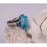 A sky blue topaz and 18ct white gold ring, the single large oval facet cut stone claw set, 16mm x