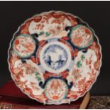 A Japanese shaped circular charger, painted in the Imari palette, 29.5cm diam, Meiji period