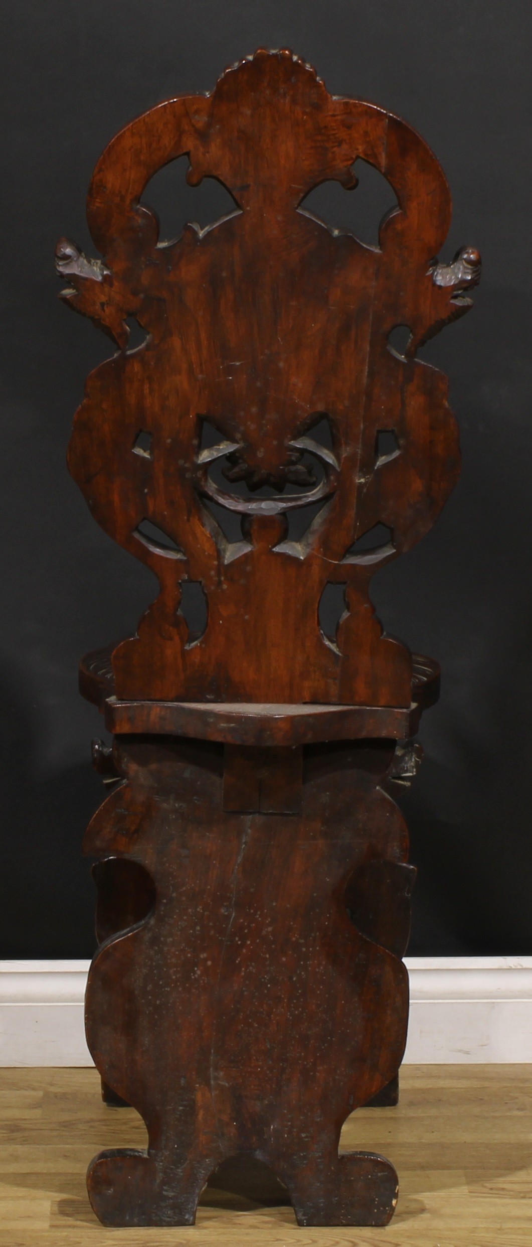 A pair of 19th century Italian walnut sgabelli or hall chairs, carved throughout in the - Image 9 of 9