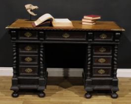 A 19th century Portuguese Baroque Revival twin pedestal desk, rectangular top with inset writing