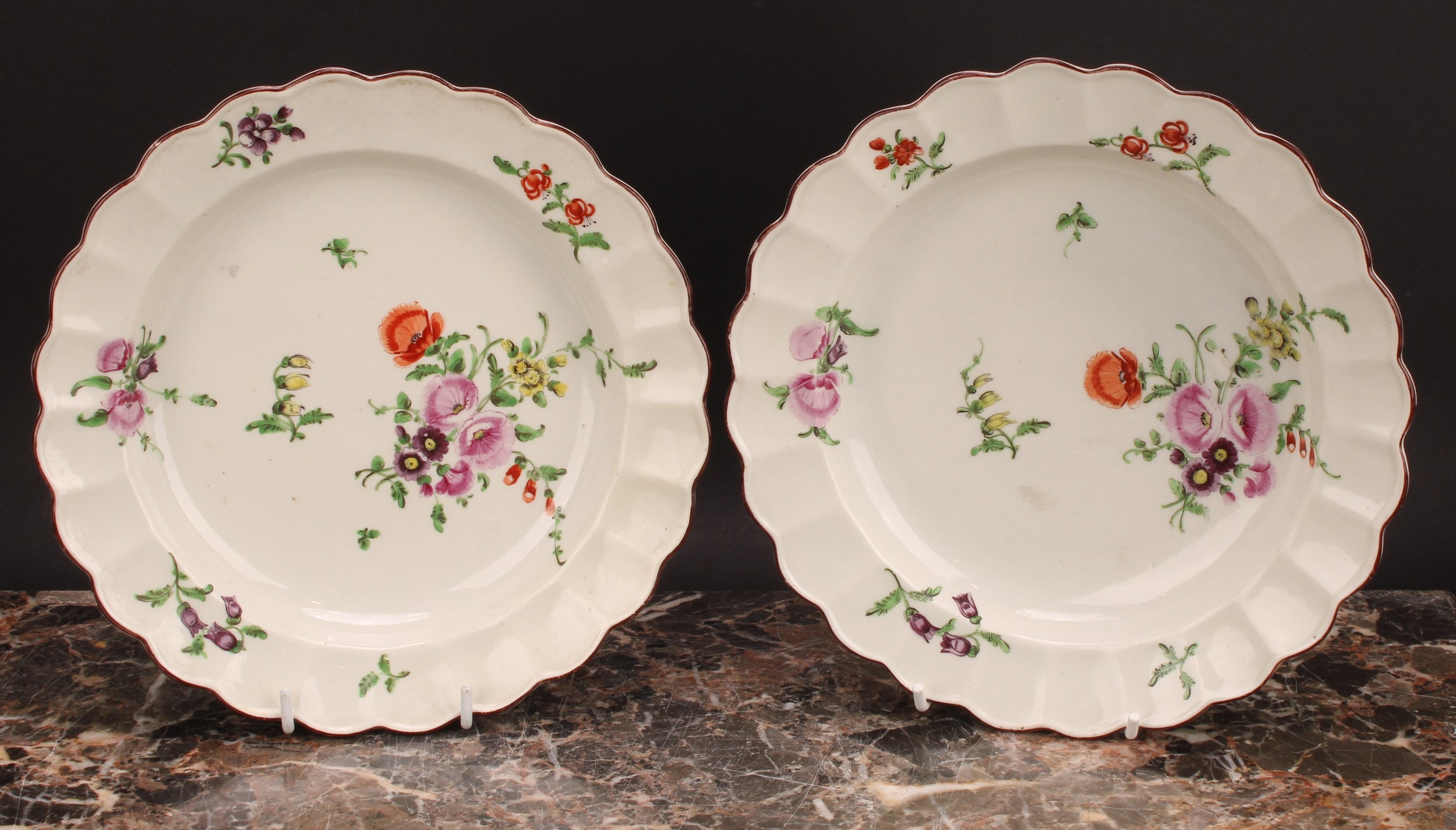 A pair of Worcester shaped circular plates, painted in polychrome with scattered flowers and sprigs, - Image 2 of 3