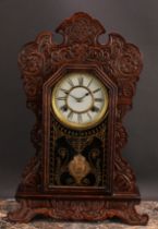 A 19th century American 'gingerbread' shelf clock, by Waterbury Clock Co, 13cm painted dial