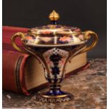 A Royal Crown Derby 1128 Imari pattern flattened campana shaped two-handled vase and cover, oval