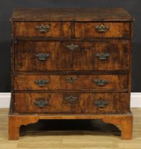 A George I walnut chest, moulded crossbanded top above two short and three long drawers, engraved