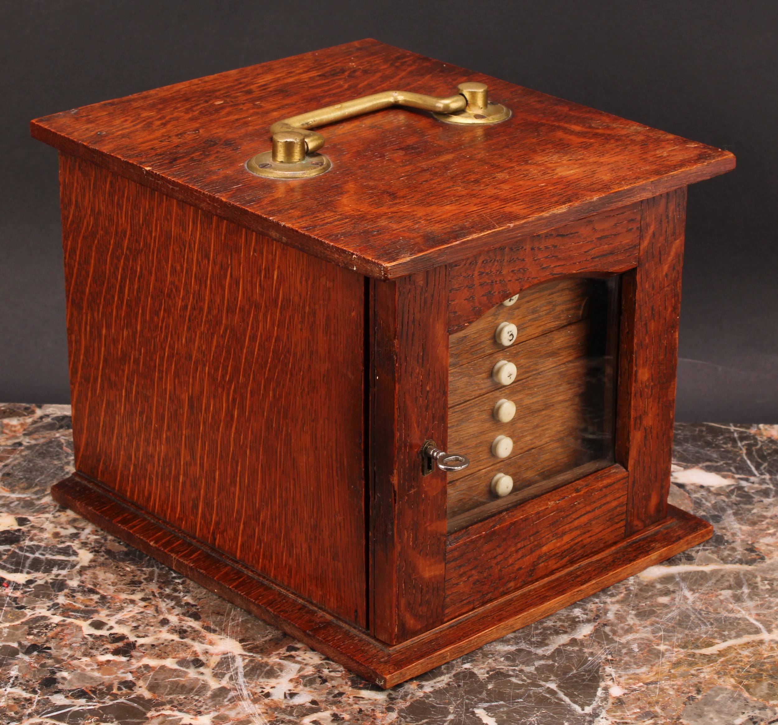 Numismatics - An Edwardian Arts and Crafts oak coin cabinet, the oversailing rectangular top with - Image 2 of 3
