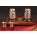 A Channel Islands silver novelty cruet stand, the condiments cast as Martello towers, each removable