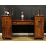 A Regency mahogany twin pedestal sideboard, sunken-centre with a long frieze drawer, flanked by deep