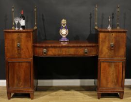 A Regency mahogany twin pedestal sideboard, sunken-centre with a long frieze drawer, flanked by deep