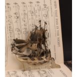 An early 20th century Dutch silver miniature nef, typically modelled as a sailing ship, with