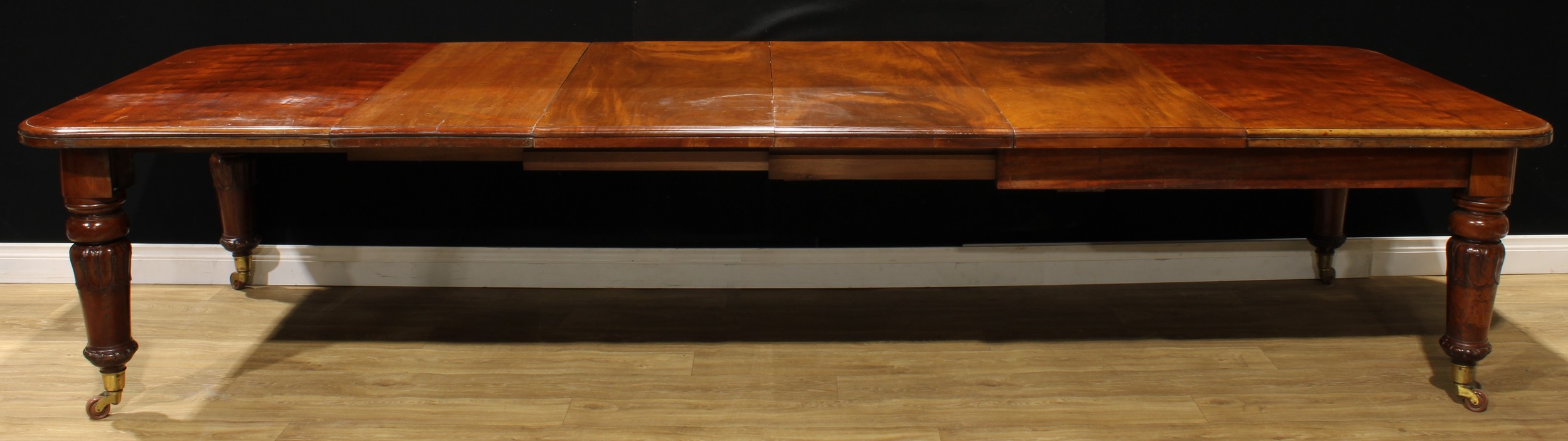 A William IV mahogany extending dining table, rounded rectangular top, four additional leaves, - Image 2 of 3