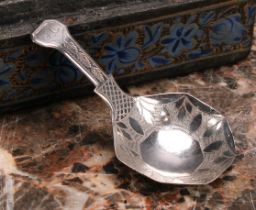 A George III silver caddy spoon, octagonal bowl, bright-cut and wriggle-work engraved, 7.5cm long,