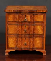 Miniature Furniture - a 19th century satinwood shaped serpentine chest, in the Sheraton taste,