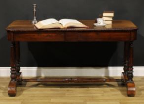 A William IV rosewood library table, in the manner of Gillows of Lancaster and London, rounded