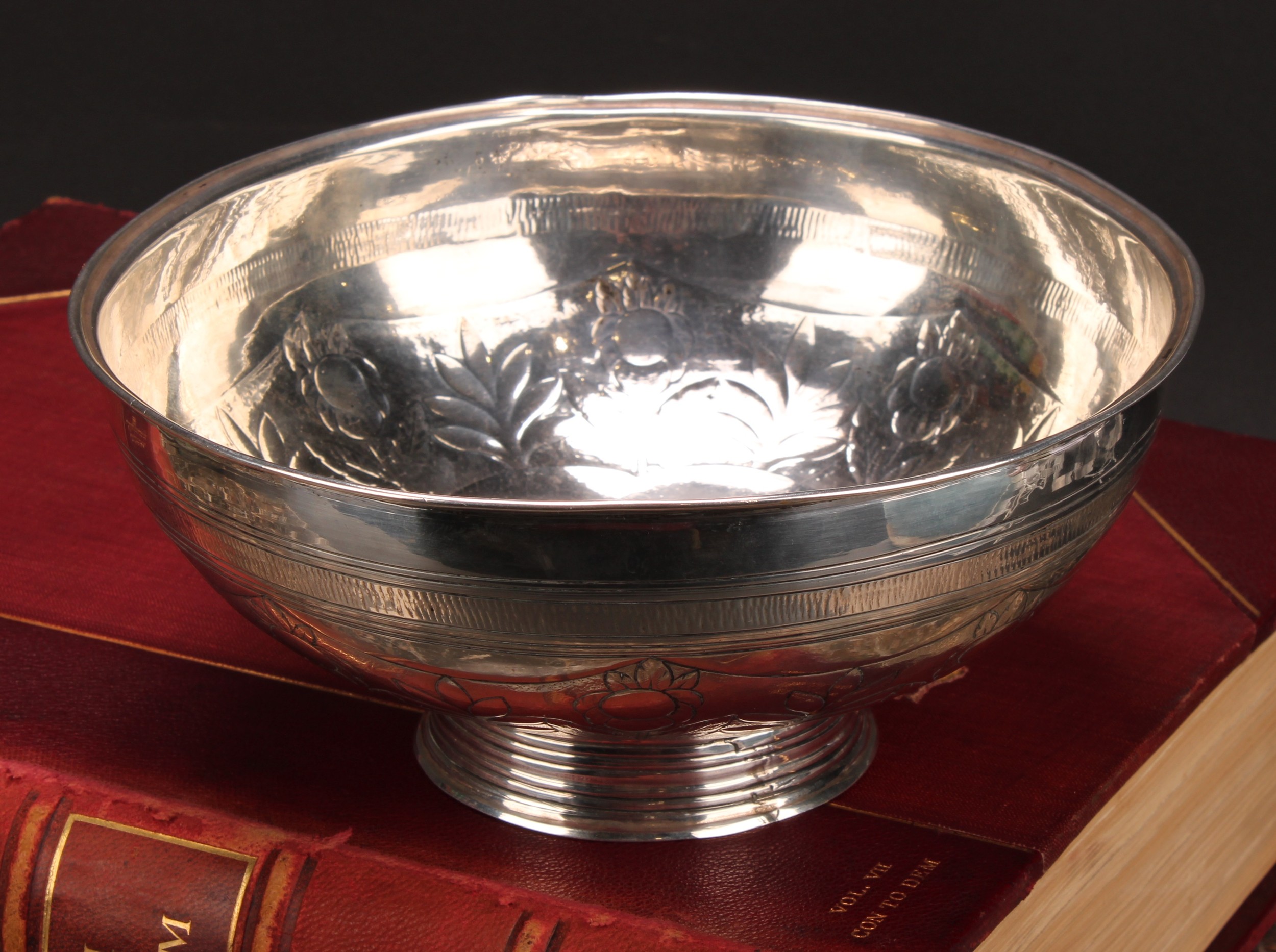 A 19th century Russian silver circular bowl, chased with an alternating band of flowers and stiff