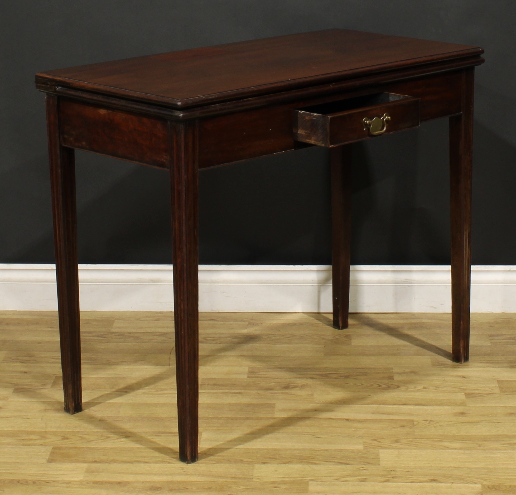 A George III mahogany card table, hinged top with moulded edge enclosing a baize lined playing - Image 5 of 7