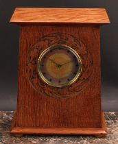 An Arts and Crafts oak mantel timepiece, 9cm circular dial decorated in mottled tones of orange