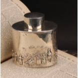 An Edwardian silver oval tea caddy, chased in the Teniers taste, push-fitting cover, 8.5cm wide,