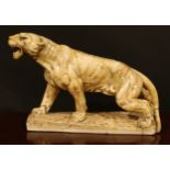 French School, first-half 20th century, an Art Deco alabaster model, of a tiger, 55cm wide