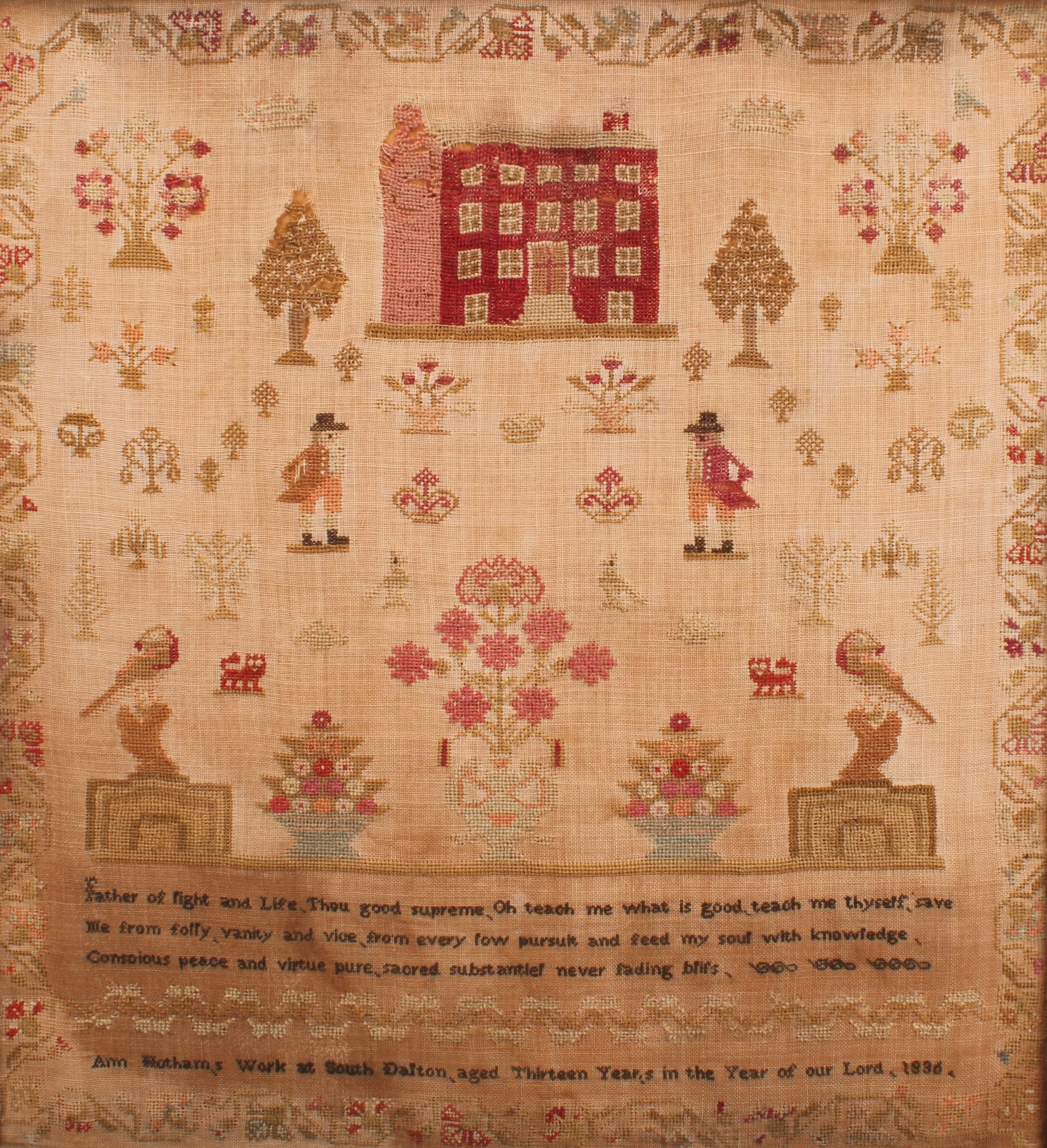 A William IV needlework sampler, worked in coloured wool with a mansion house, figures, trees,