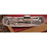 A George IV silver rounded rectangular snuffer tray, gadrooned border outlined with flowers and