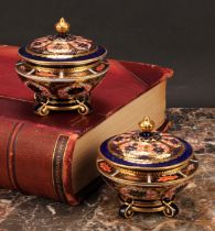 An associated pair of Royal Crown Derby 1128 Imari pattern campana shaped boxes and covers, of