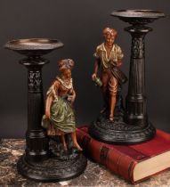 A pair of Gerbing & Stephan figural table comports, each as a young gatherer, he with a basket of