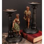 A pair of Gerbing & Stephan figural table comports, each as a young gatherer, he with a basket of