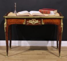 A French Louis XV Revival gilt metal mounted rosewood and kingwood bureau plat, slightly oversailing