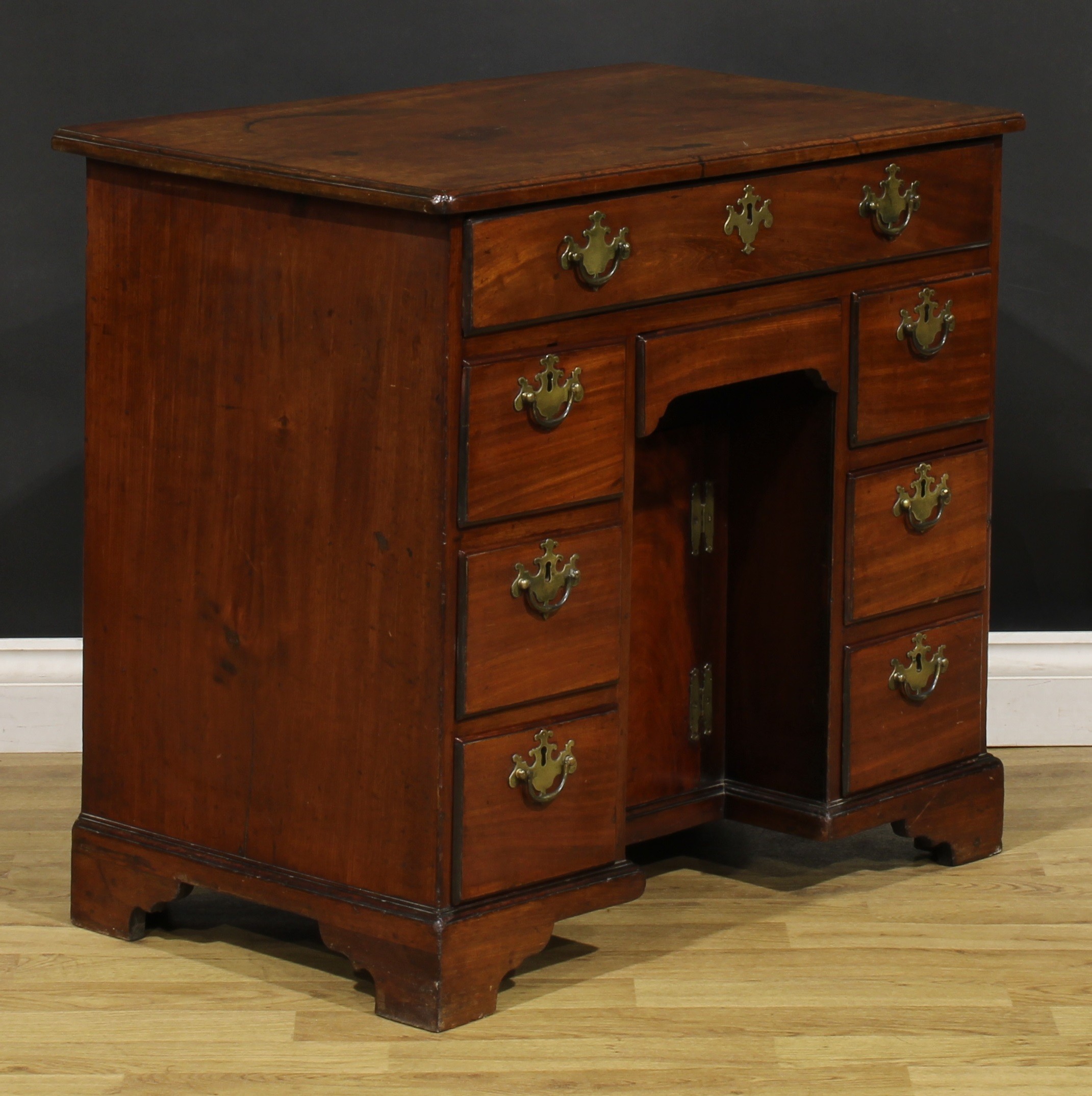 A George III mahogany kneehole desk, slightly oversailing top above an arrangement of eight drawers, - Image 3 of 6