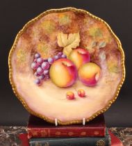 A Royal Worcester shaped circular plate, painted by R. Price, signed, with apples and grapes on a