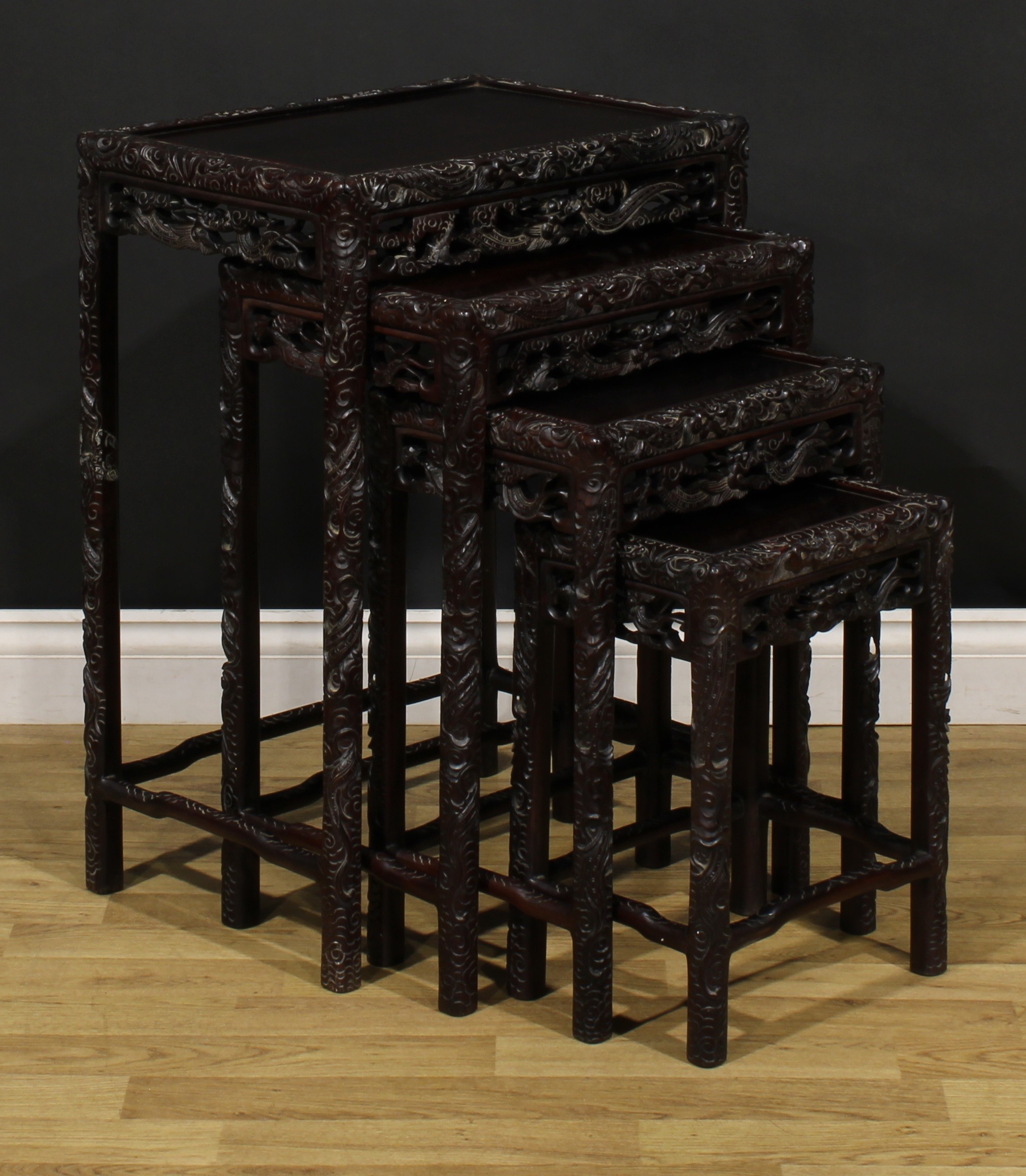 A set of Chinese hardwood quartetto tables, each carved throughout with dragons, the largest 70. - Image 2 of 6