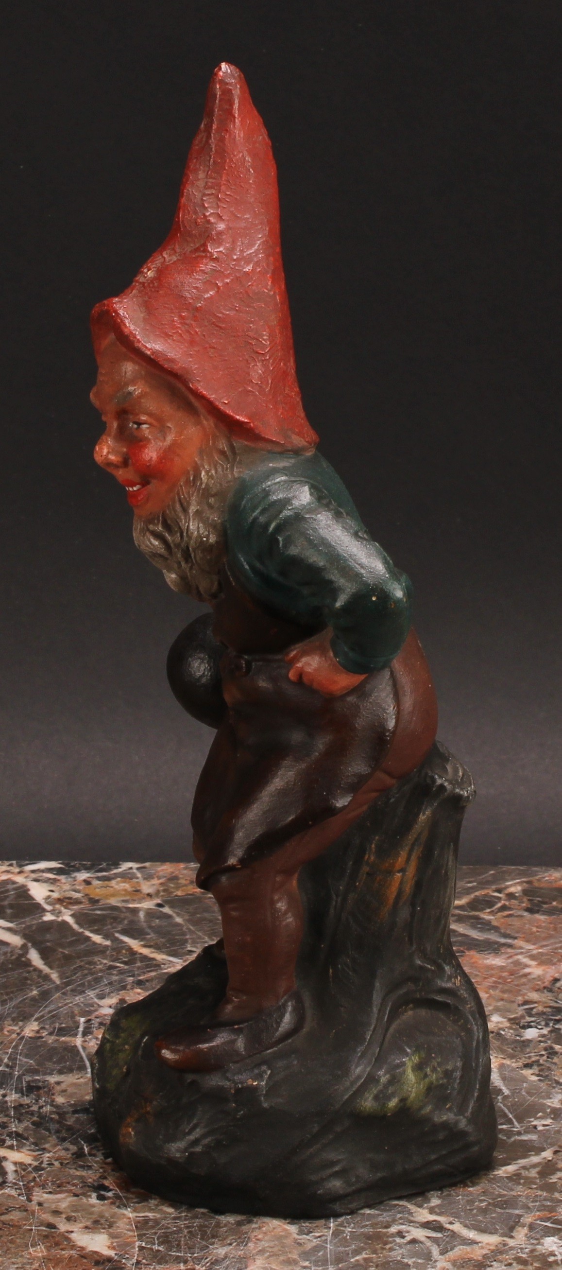 An Austrian terracotta gnome, by Johann Maresch, he stands, beside a barrel, holding a bowling wood, - Image 4 of 6