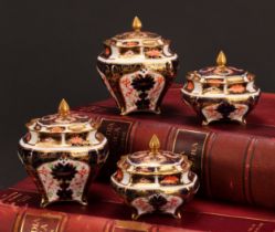 An associated pair of Royal Crown Derby 1128 Imari pattern shaped square boxes and covers, of