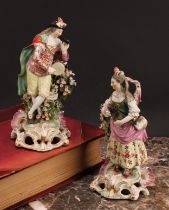 A Derby pair of patch mark figures, of Musicians, she stands playing the triangle, wearing