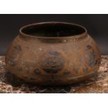 A Middle Eastern silver and copper damascened brass bowl, decorated in the Islamic taste with
