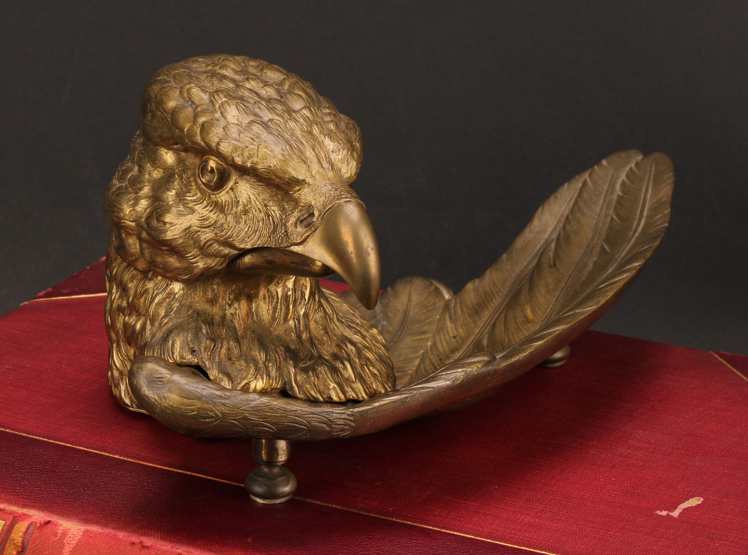 A French gilt metal novelty inkwell, cast as the head of an eagle, 28.5cm wide