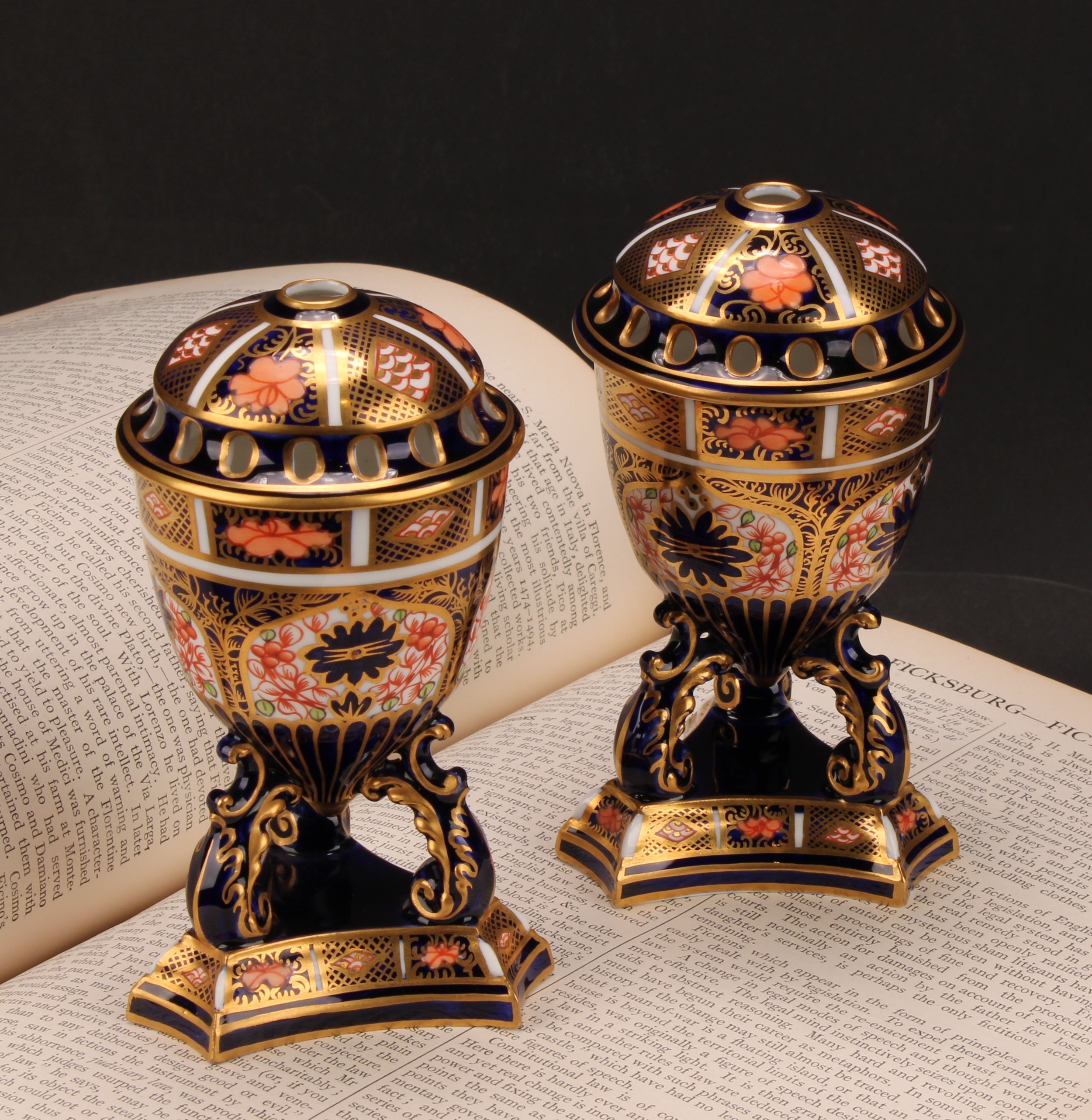 A pair of Royal Crown Derby 1128 Imari pattern egg shaped pedestal pot pourri jars and covers,