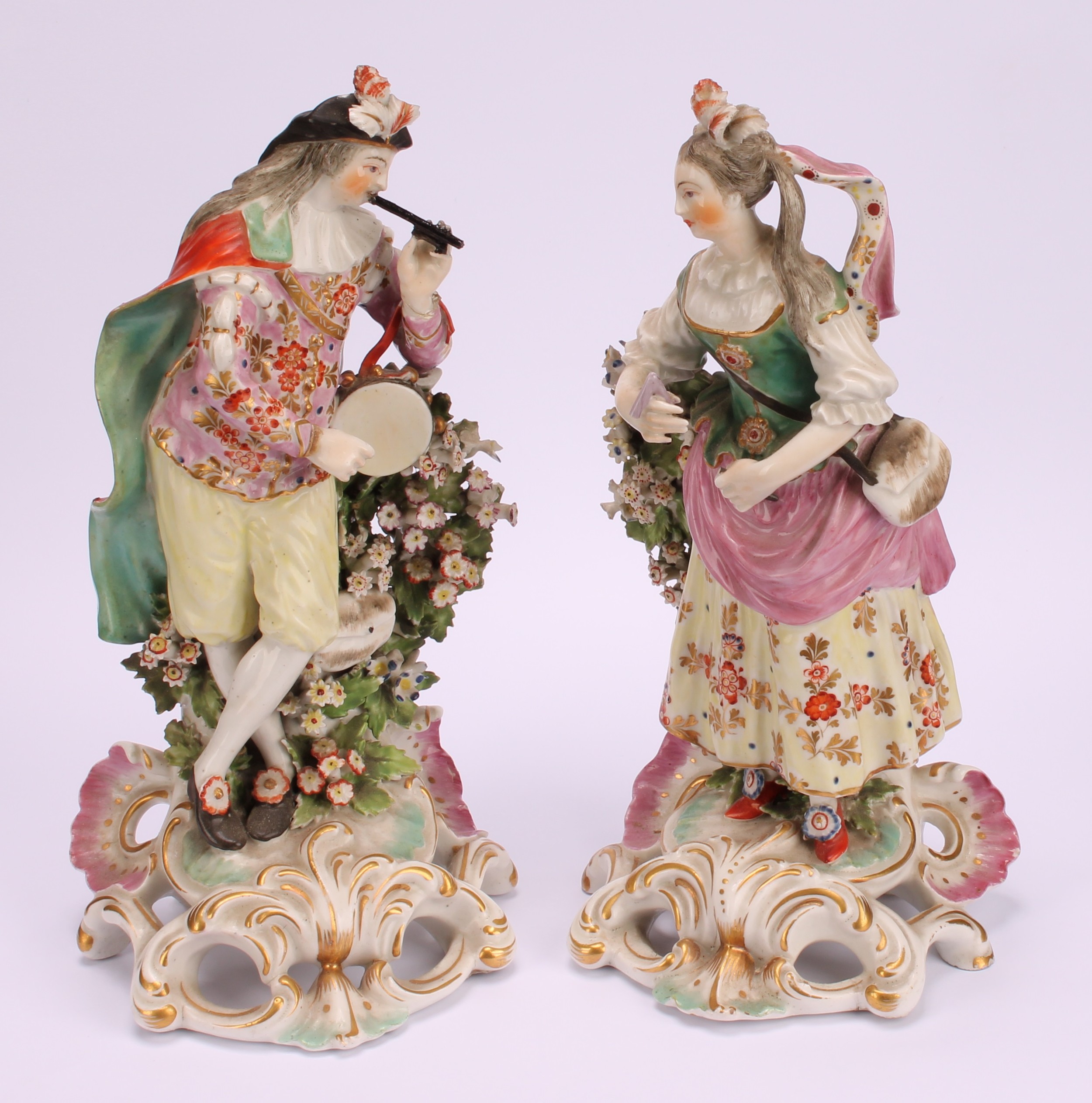 A Derby pair of patch mark figures, of Musicians, she stands playing the triangle, wearing - Image 2 of 10