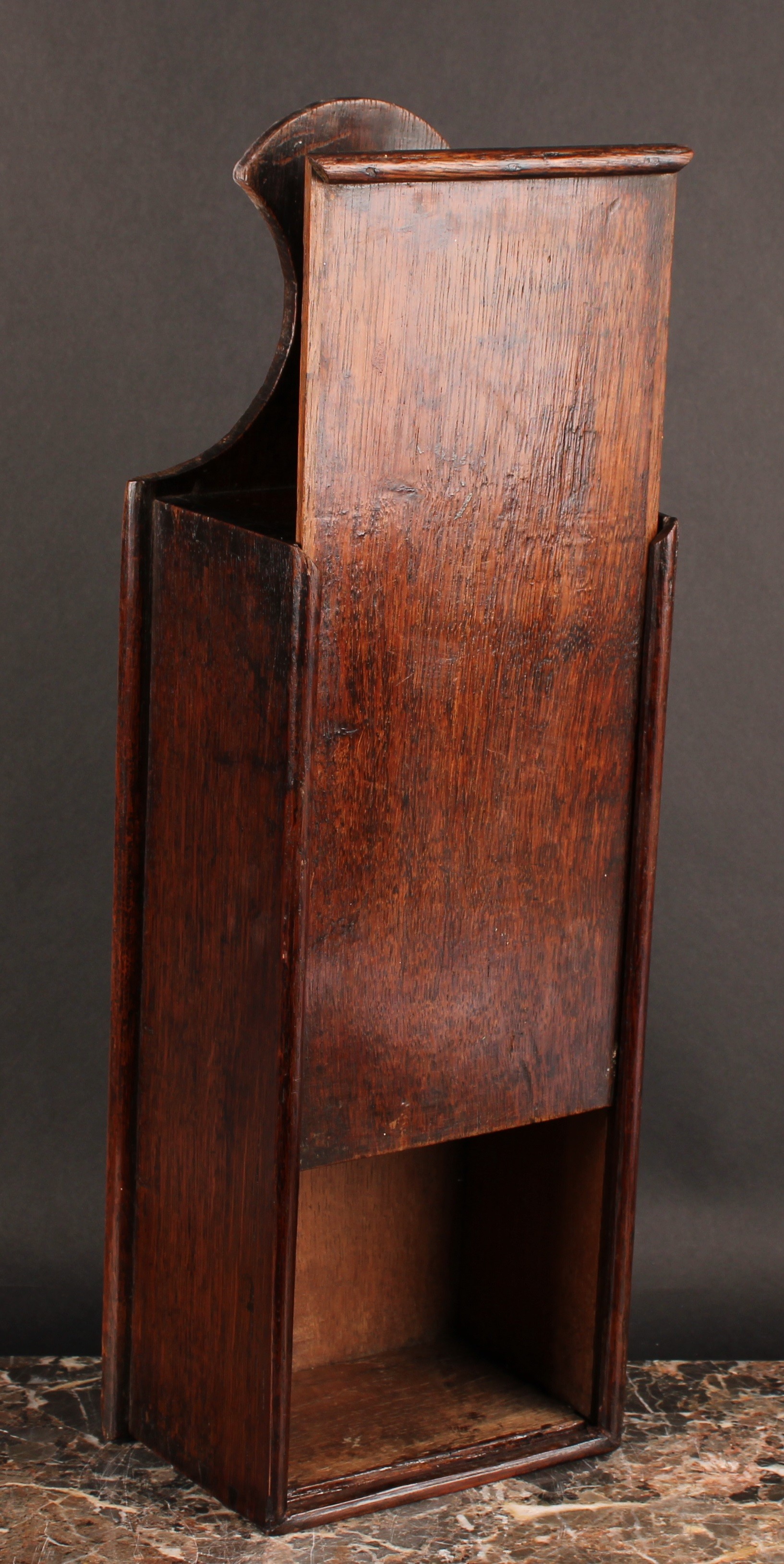 A George III oak candle box, axe-head shaped cresting, sliding cover, 50cm high, c.1800 - Image 3 of 3