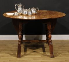 An oak dropleaf dining table, by Rupert/Nigel Griffiths Monastic Woodcraft, 74cm high, 60.5cm