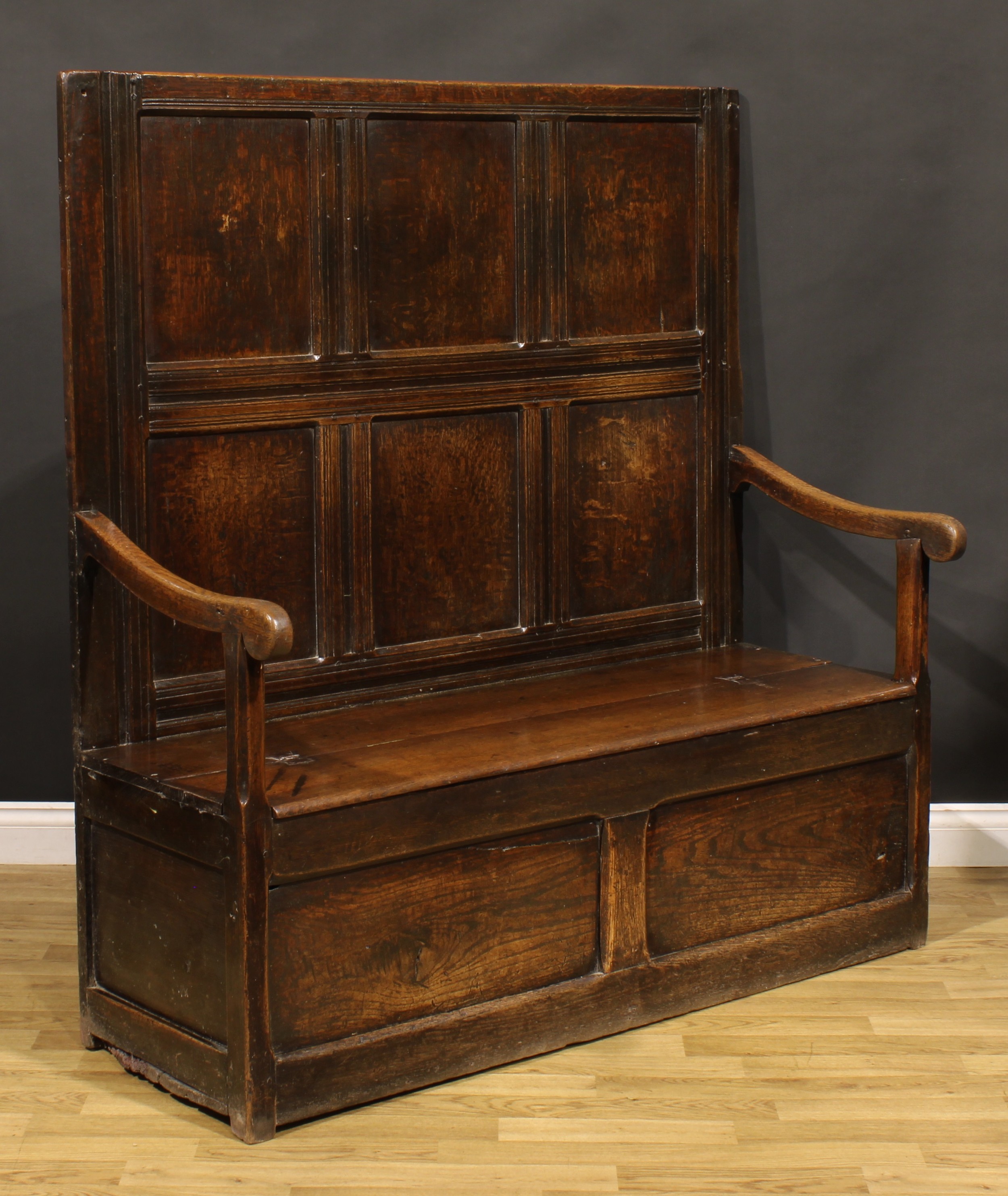 An 18th century oak box settle, rectangular panel back, hinged seat, 147cm high, 140cm wide, the - Image 2 of 4