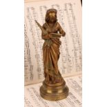 After Maurice Constant Favre (French, 1875-1919), a gilt bronze, Chant de la Fileuse, depicting a