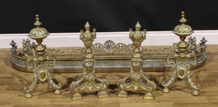 A pair of Louis XV Revival brass andirons, urn finials, above bell husk swags, 52cm high; another