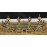 A pair of Louis XV Revival brass andirons, urn finials, above bell husk swags, 52cm high; another