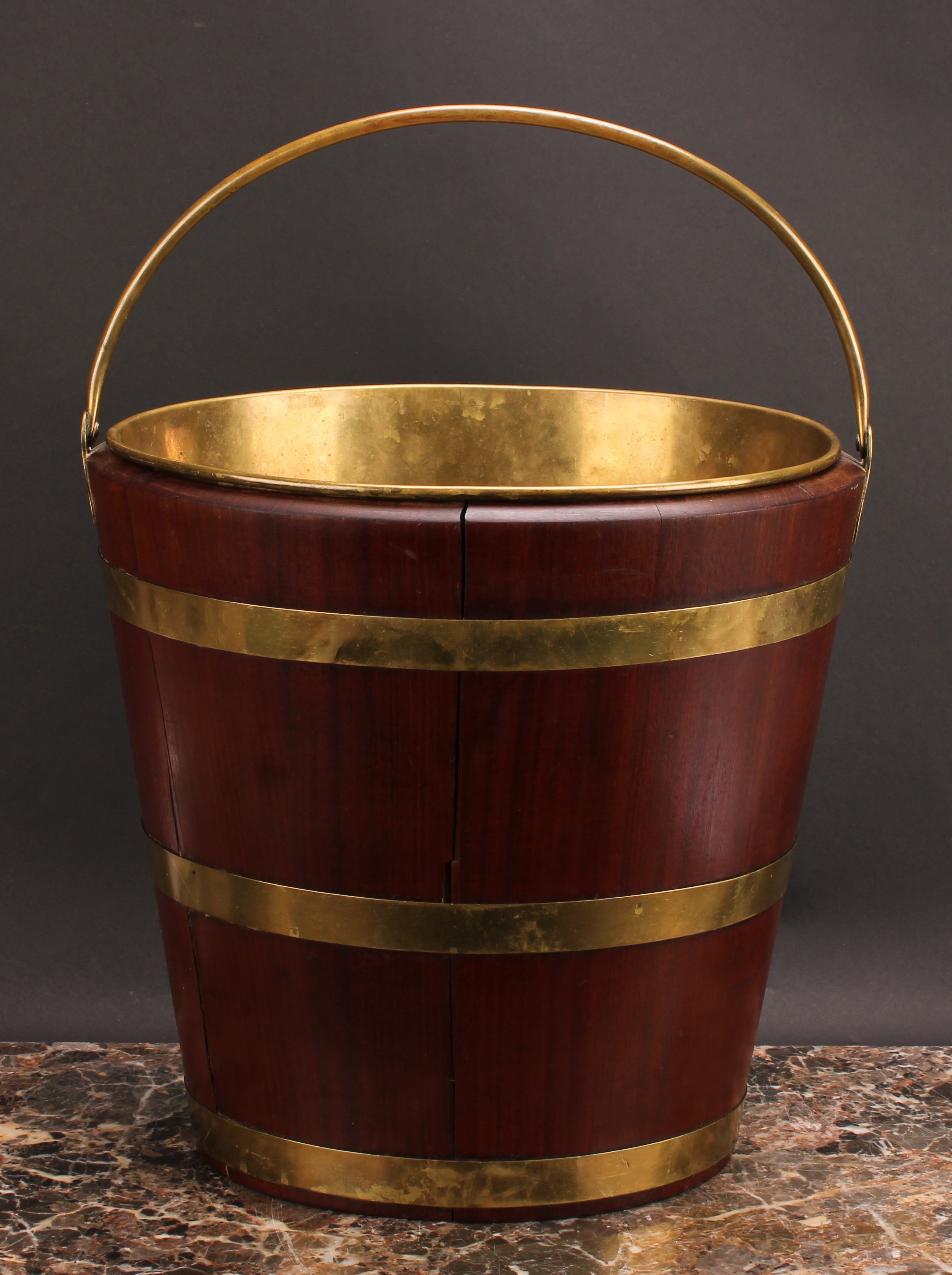 A Dutch brass bound coopered oyster bucket or peat bucket, 47cm high over handle, 34.5cm wide,