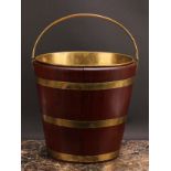 A Dutch brass bound coopered oyster bucket or peat bucket, 47cm high over handle, 34.5cm wide,