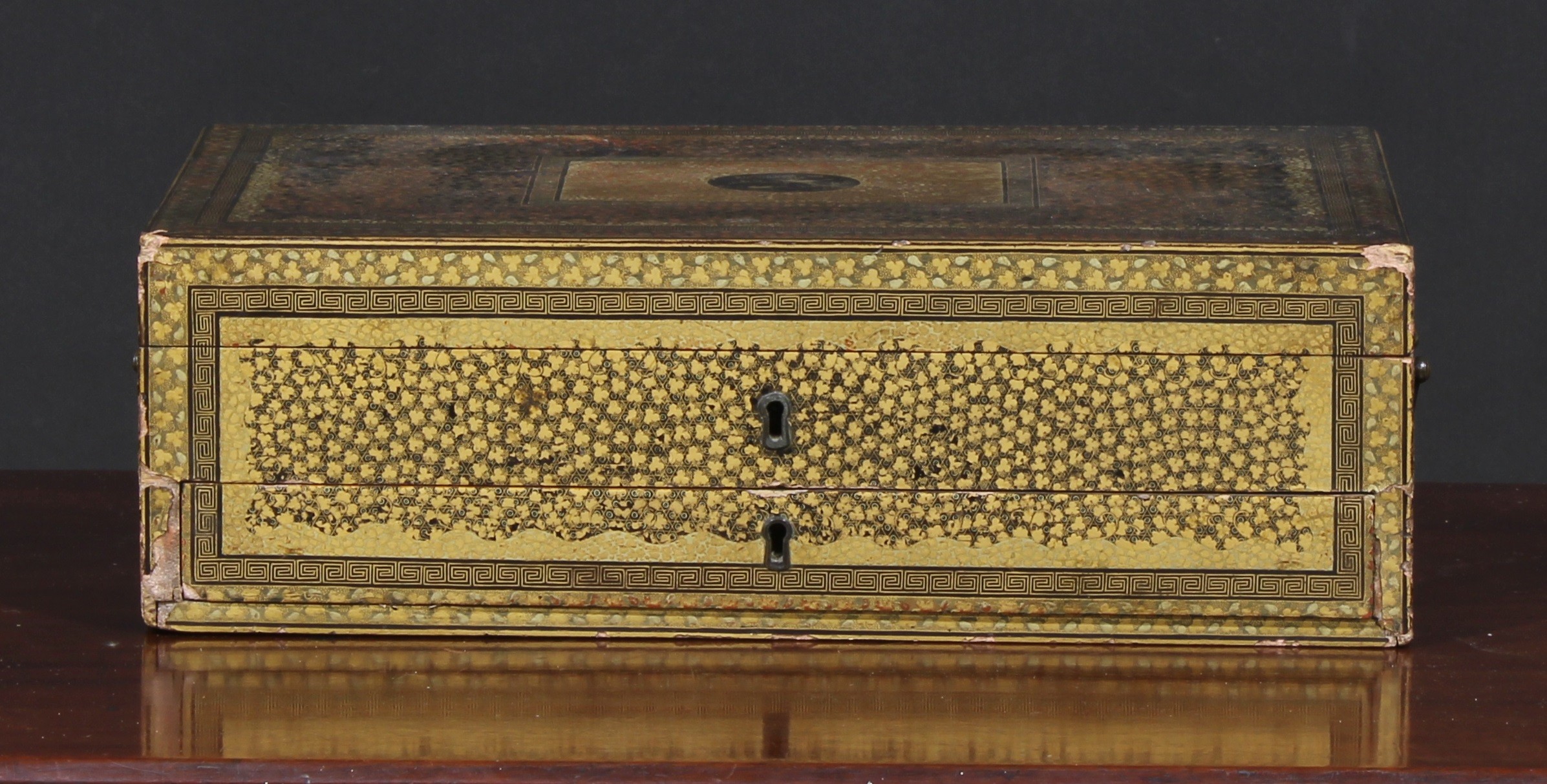 A Japanese black lacquer and parcel gilt rectangular games or work box, decorated with clover on a