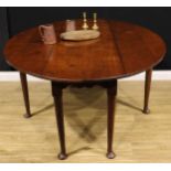 An 18th century style oak Irish wake table, oval top with fall leaves above a deep shaped frieze,