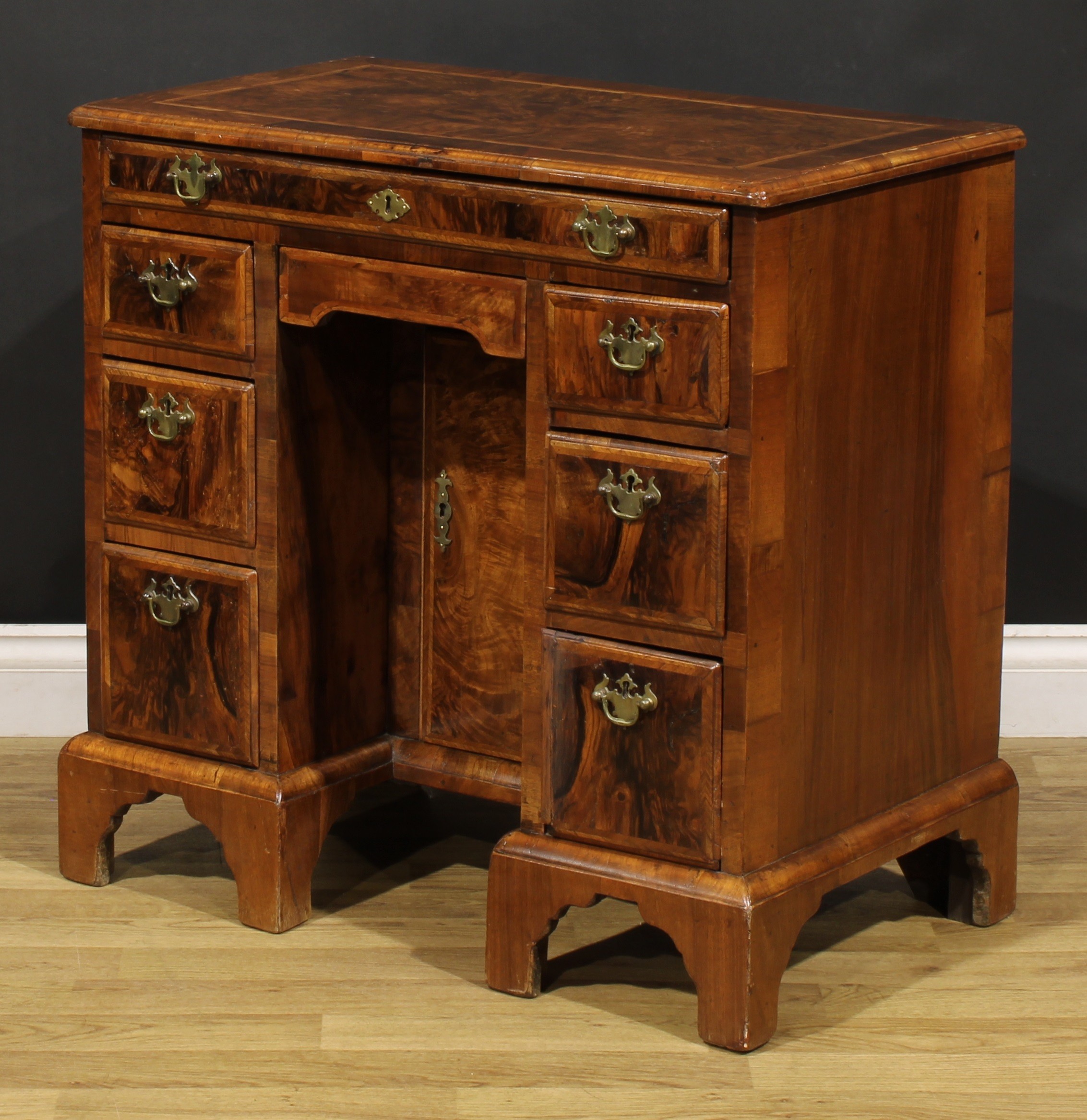A George II featherbanded walnut kneehole desk, rectangular top with moulded edge above an - Image 5 of 6
