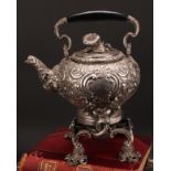 A large French Rococo Revival silver plated spirit kettle, burner and stand, profusely chased with